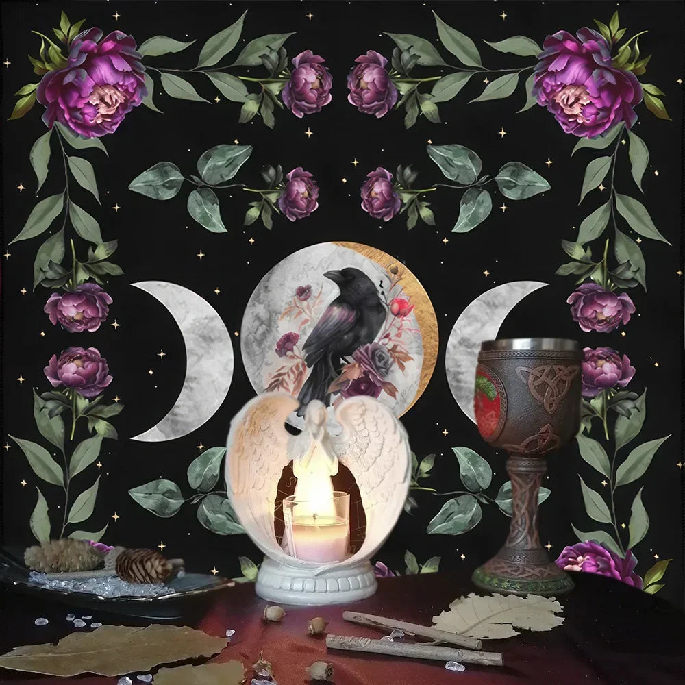 Decorative setup with a candle, gourd, and crow on a dark background with flowers and moon symbols.