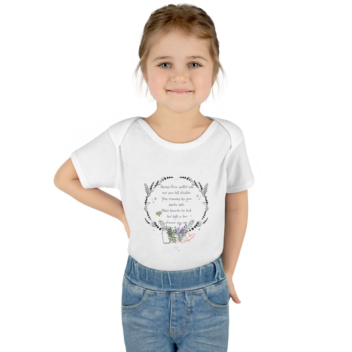Young girl wearing a white t-shirt with a design and text on a white background
